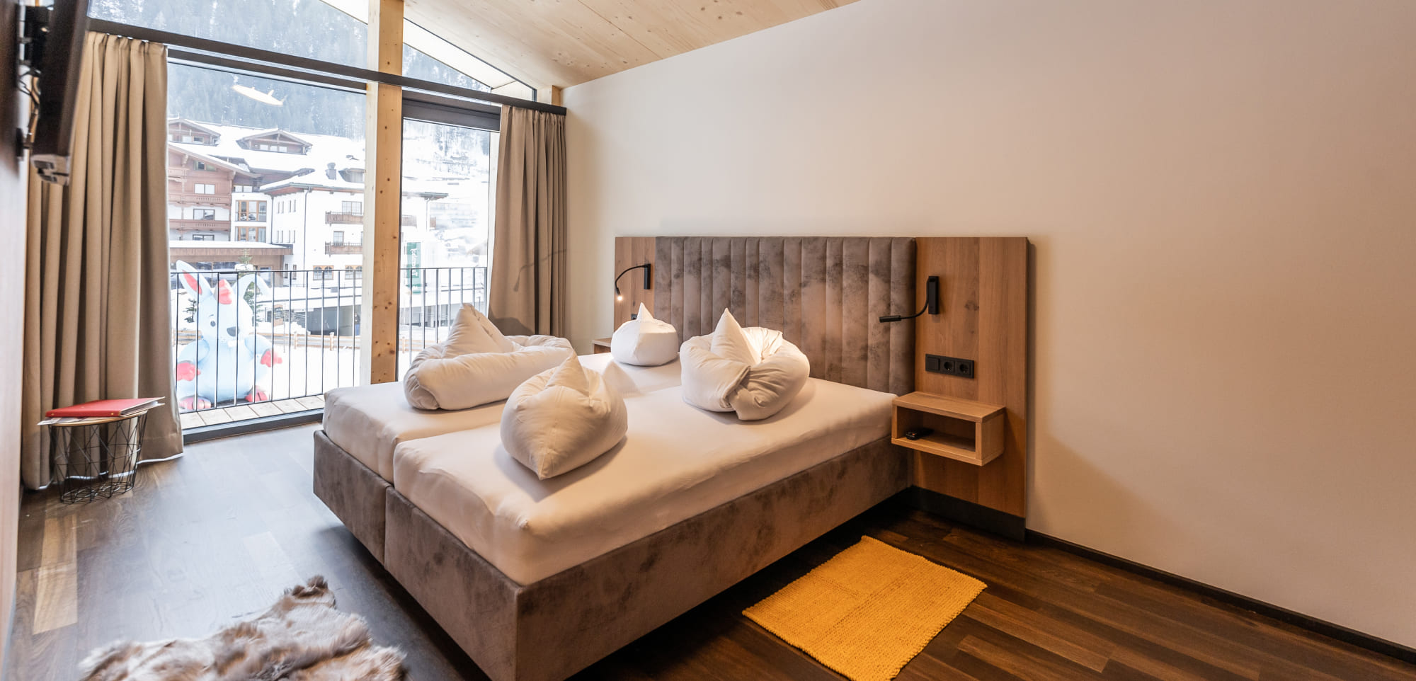 Doppelbett im Loft in den Appartements Lackner in Großarl